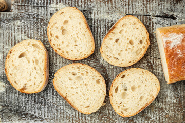 Fresh bread. Texture of sliced loaf of bread Italian ciabatta. Food recipe background. Close up