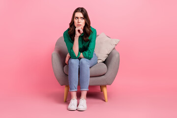 Full length photo of depressed upset woman wear green shirt sitting couch looking emtpy space...