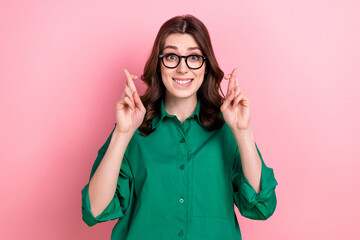 Photo of worried corporate person biting lips crossed fingers pray hope isolated on pink color background - Powered by Adobe