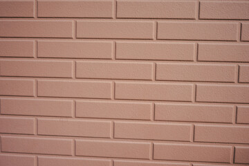 Texture of a light beige brick wall. Plain background as copy space..
