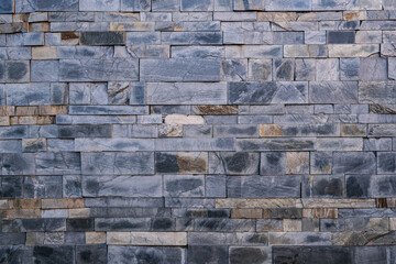 Dark gray natural stone slate facade wall background texture