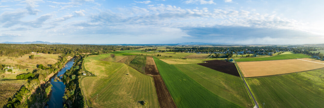 Hunter River running past fertile Australian farmland river flats in summer