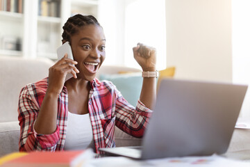 Emotional young black lady independent contractor working from home