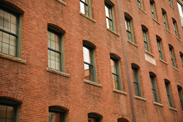 Old brick building apartment and office building in providence rhode island that shows industrial aged factory and architecture with windows 