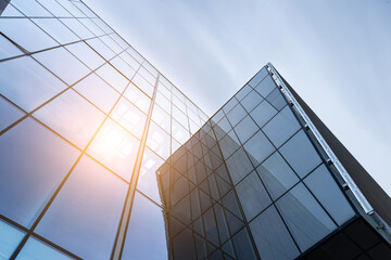 Sunset reflected off modern glass facades of skyscrapers in the financial center of the city