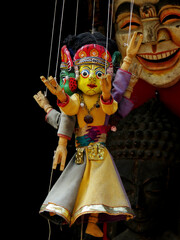 Masks, dolls, and souvenirs in street shop at Durbar Square in Kathmandu, Nepal. Traditional...