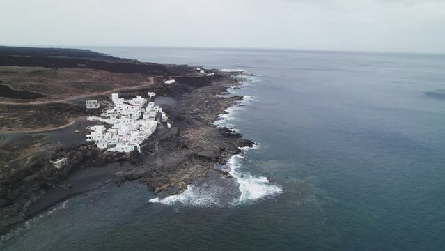 View of the Tenesar village in Lanzarote, Canary Islands, big waves crashing