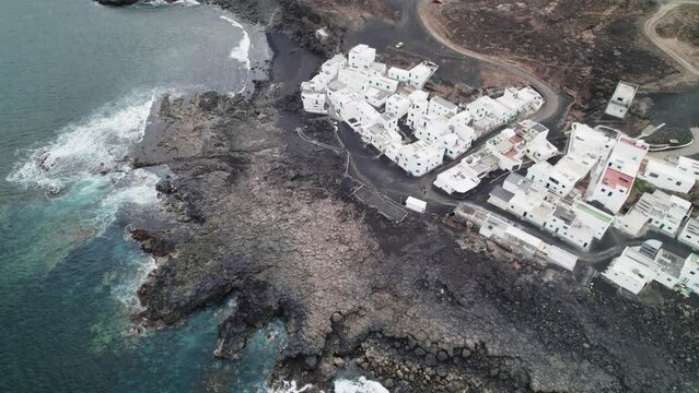 Topshot of the Tenesar village in Lanzarote, Canary Islands, big waves crashing