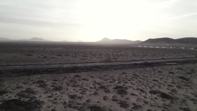 Flying over Lanazrote desert, volcanos in the horizon