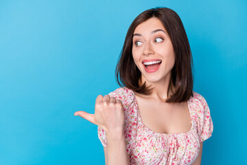 Closeup photo of young pretty nice woman looking empty space pointing finger curious crazy...