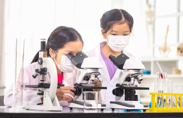 Elementary science class, Cheerful kids girl in school laboratory, Science laboratory