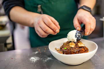 chef cooking dessert in the kitchen