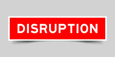 Red color square shape sticker label with word disruption on gray background