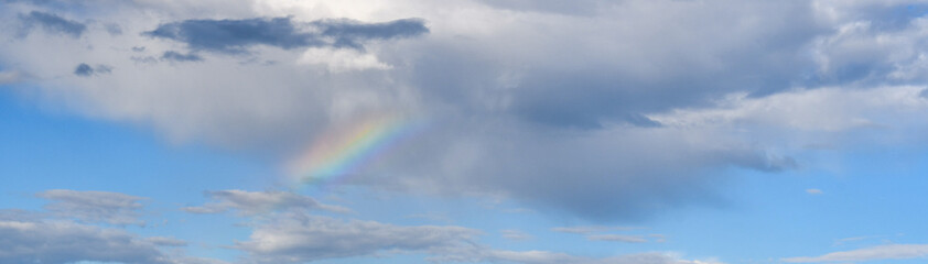 blue sky with rainbow background