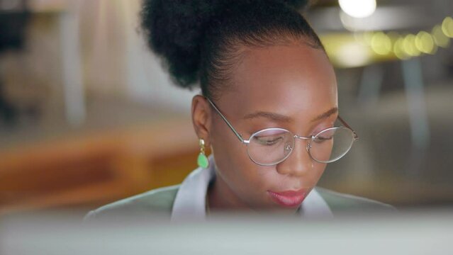 Glasses, business and face of black woman on laptop working on research, online documents and report. Corporate, technology and female worker typing on computer for strategy, planning and internet