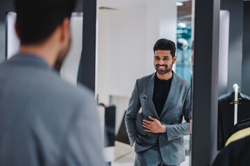 Young man shopping in clothing store
