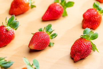 Fototapeta na wymiar Fresh ripe strawberry on the wooden board