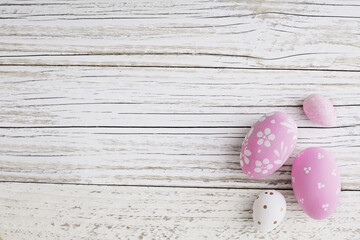 spring decoration with easter eggs on wooden background