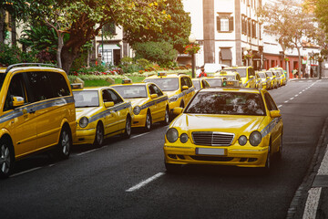 Fototapeta na wymiar Taxi service on the roads of city.