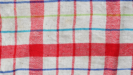 The texture of fabric. Red lines on the fabric. Background