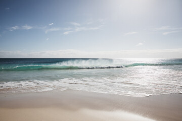 Waves on beach in morning light