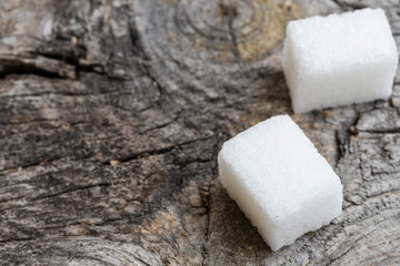 Crystal white granulated sugar. Crystal sugar photos on wood for diabetics to stay away from