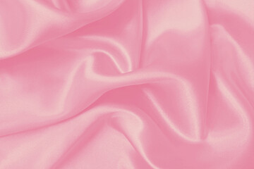 Soft pink fabric texture background, detail of silk or linen pattern.