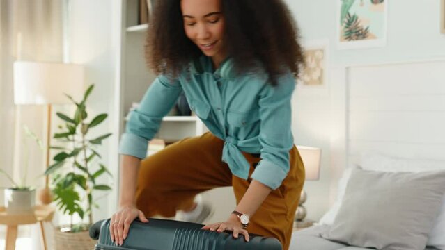 Black woman, suitcase and packing for travel in bedroom in home or vacation apartment. Luggage, clothes and happy african woman ready for holiday trip, solo adventure or traveling journey to Africa