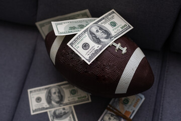 Fototapeta Football ball and money on gray background obraz