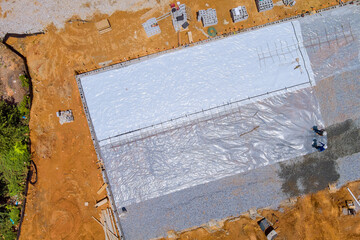 It is advisable to lay polyethylene for waterproofing foundation before pouring concrete over it