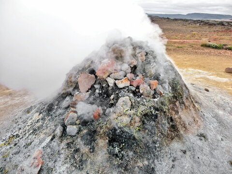 Close-up of steam coming out of a geothermal fumarole in summer, Iceland