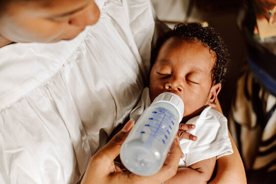 newborn drinking bottle milk