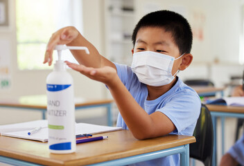 Covid, hand sanitizer and school student with mask cleaning, protecting and staying safe in...