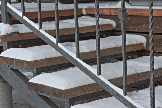 Rusty baluster stairs to the veranda