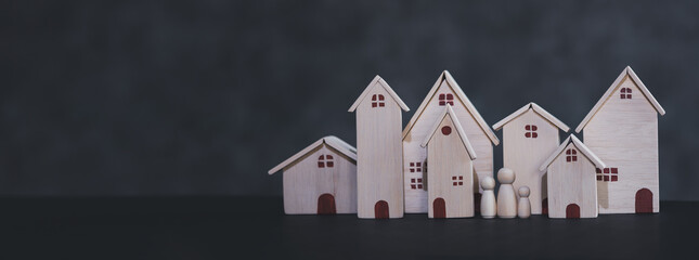 Various wooden house models are empty on the table, the concept of building a house for the future.