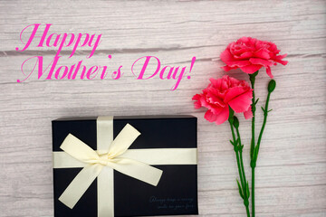 Mother's Day carnations and gifts (wood grain background)