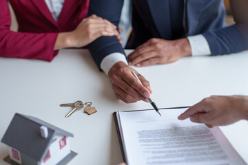 Couple enters into a home purchase contract with a real estate agent, getting advice, insurance, and signing contract.