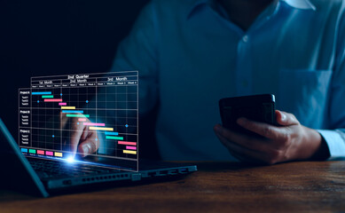 Project manager working on tablet. updating tasks and milestones progress planning with Gantt chart...