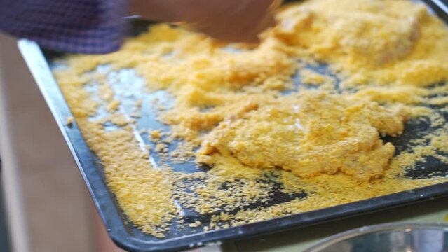 A chef is making deep-fried cutled  Pork and fried cutled Chicken