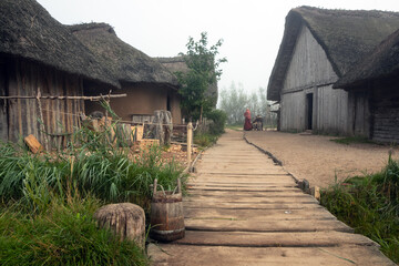 Fototapeta na wymiar historic viking city Haithabu with thatched houses