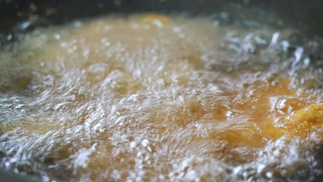 A chef is making deep-fried cutled  Pork and fried cutled Chicken