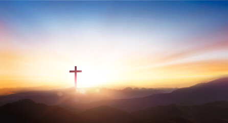 Obraz na płótnie Canvas Silhouette of crucifix cross on mountain at sunset sky background.