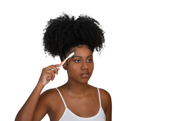woman doing a baby hairstyle on her afro hair