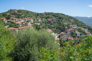 Obraz premium Small historic town of Karitena on Peloponnes in Greece. Small village between green trees in the Highlands of Arcadia