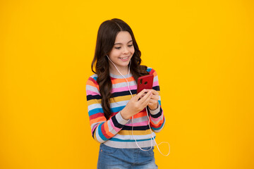 Happy teenager girl 12, 13, 14 years old with smart phone. Hipster teen girl types message on cellphone, enjoys mobile app. Kid hold smartphone texting in online social media. Internet addiction.