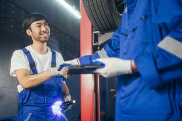 Mechanic worker hand shaking with colleague for success agreement at work. Teamwork and collaboration after service