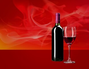 Bottle and glass of tasty red wine.