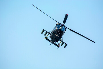 Fototapeta premium Helicopter take off from a paddy field in countryside in a dawn