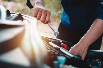 Mechanic open vehicle hood checking up auto mobile, fixing a car at home,Repair and service