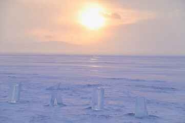 Sunset View of Frozen Lake Baikal with Row of Ice Cubes